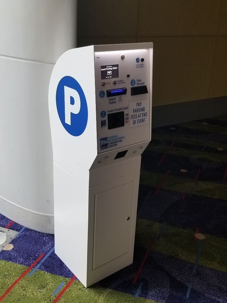 A white parking meter with a blue p on it