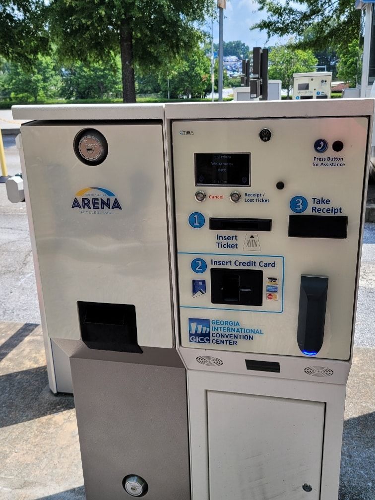 A parking meter with the word arena on it