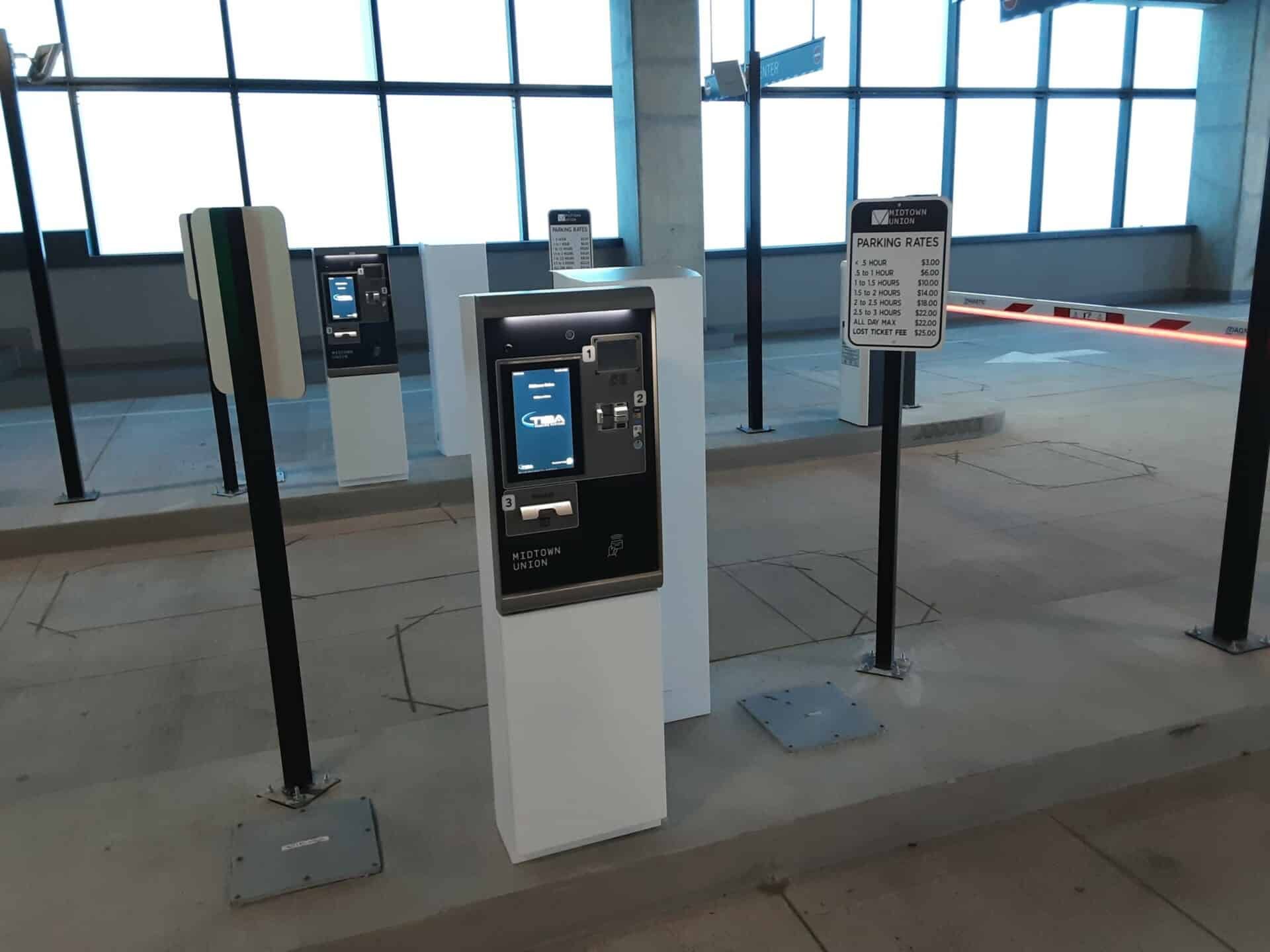 A row of parking meters in a parking garage