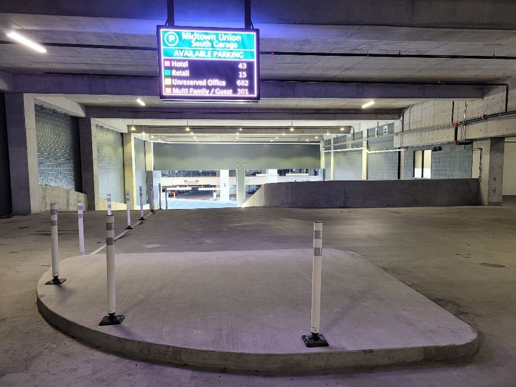 A parking garage with a sign above the entrance