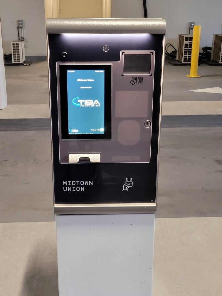 A neotown union machine is sitting in a parking garage
