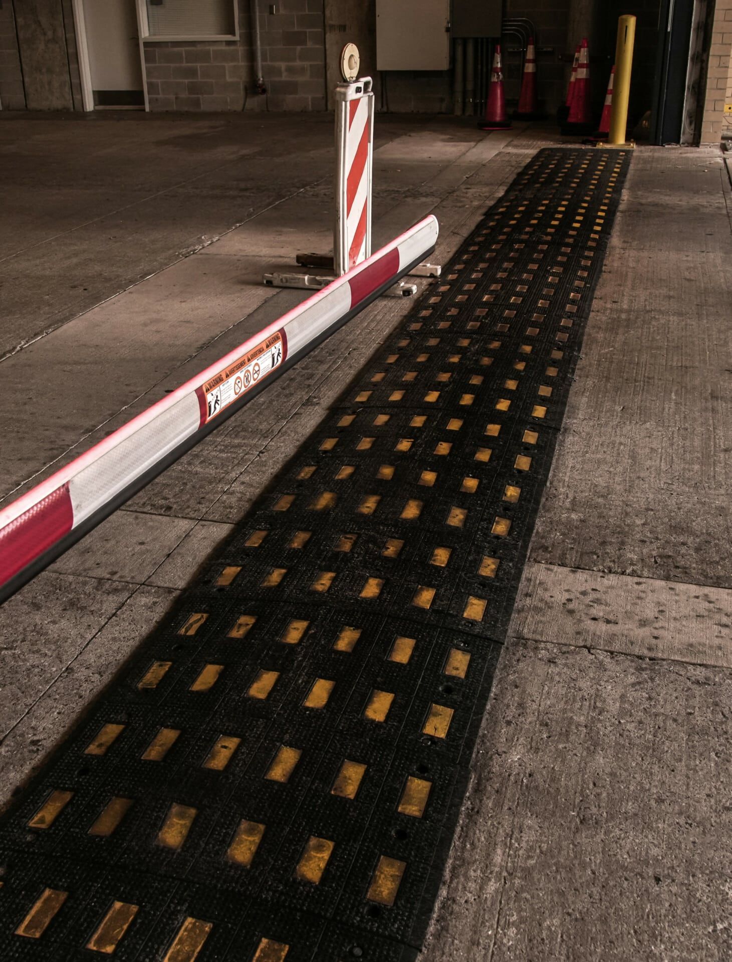 A red white and black barrier with the word open on it