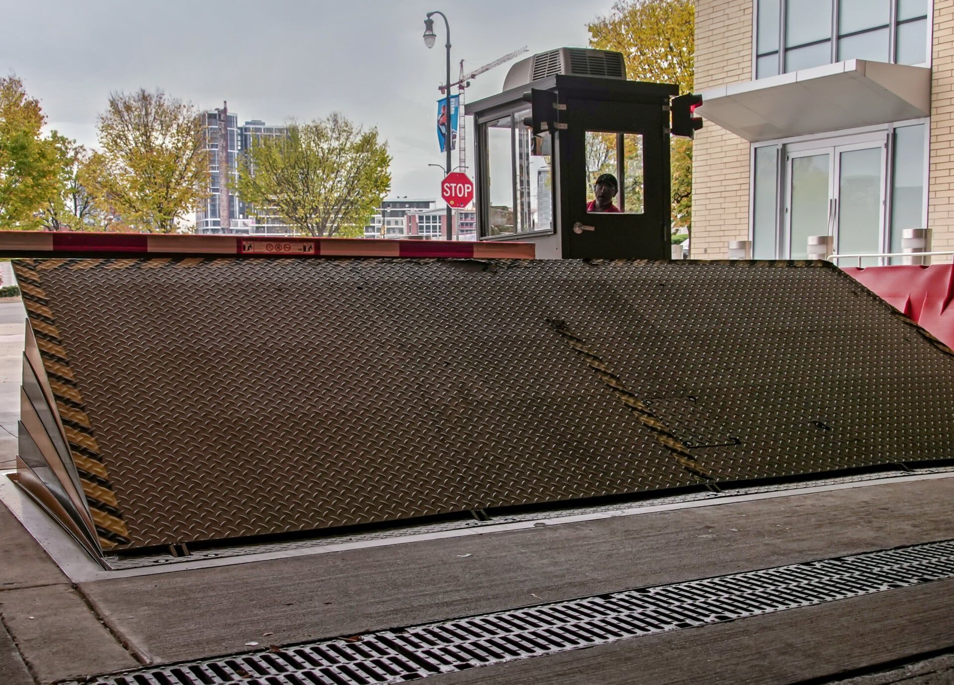 A large metal barrier is sitting on the side of the road