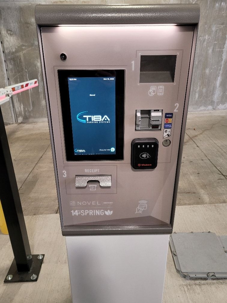 A parking meter with a screen that says tba on it.