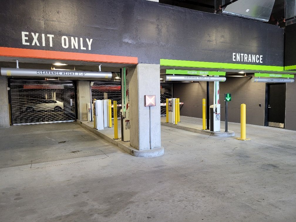 A parking garage with a sign that says exit only