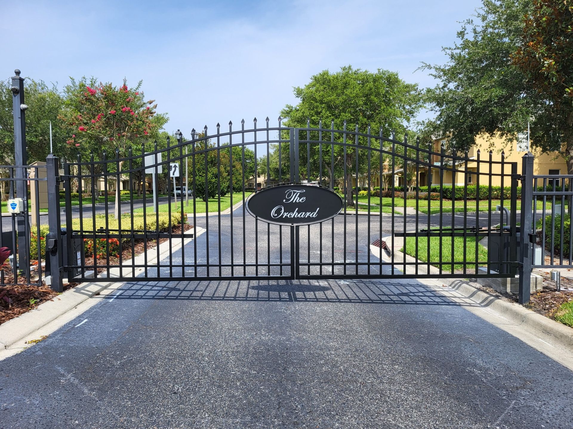 A wrought iron gate with a sign that says the labyrinth
