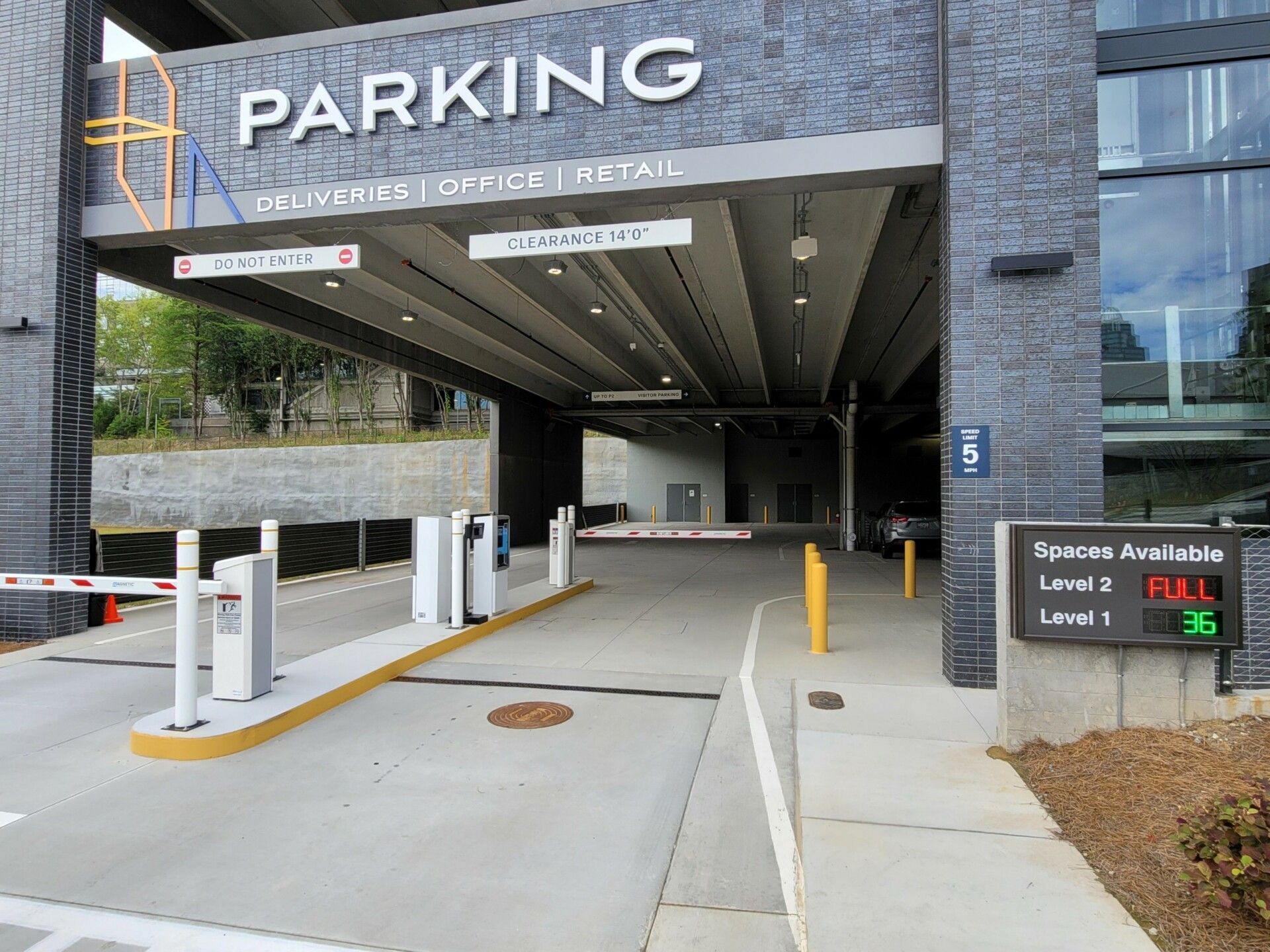 A parking garage with a sign that says parking on it