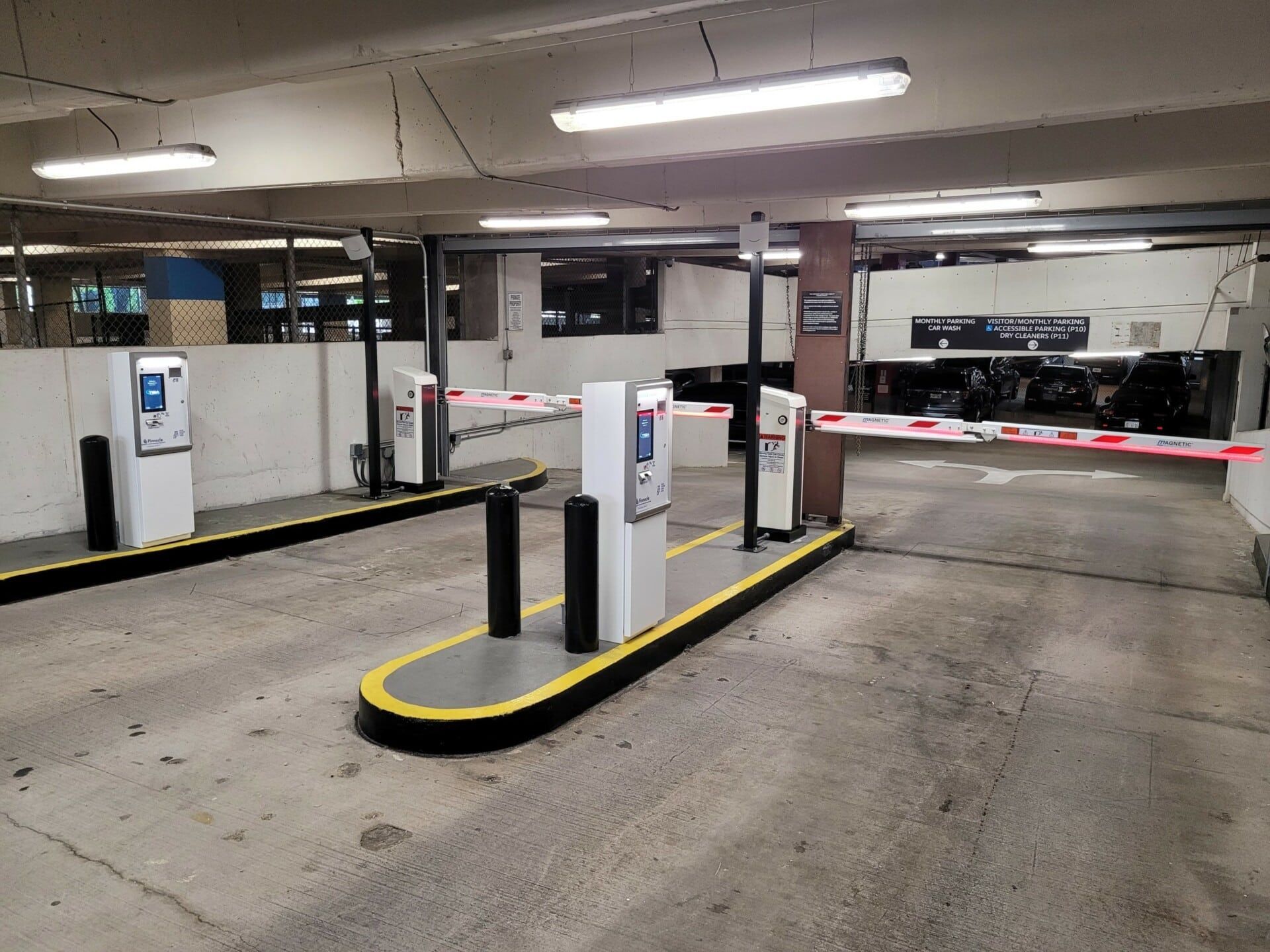 A parking garage with a lot of gates and barriers