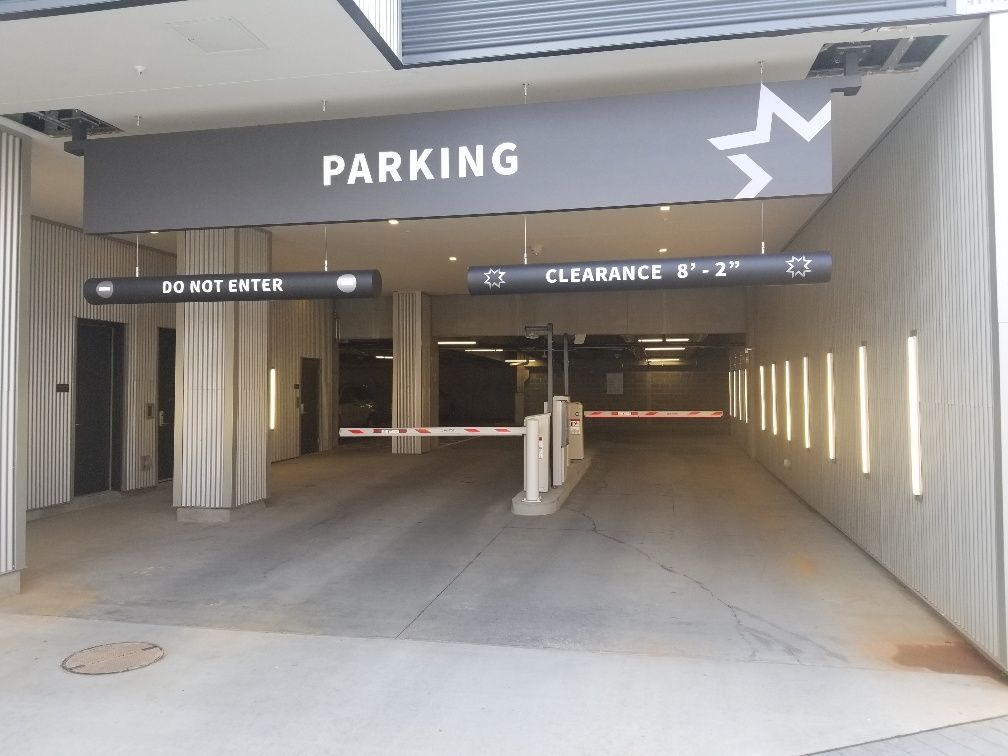 A parking garage with a sign that says parking