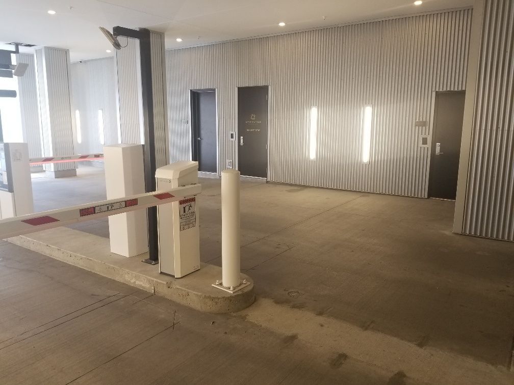 There is a barrier in the middle of a parking lot.