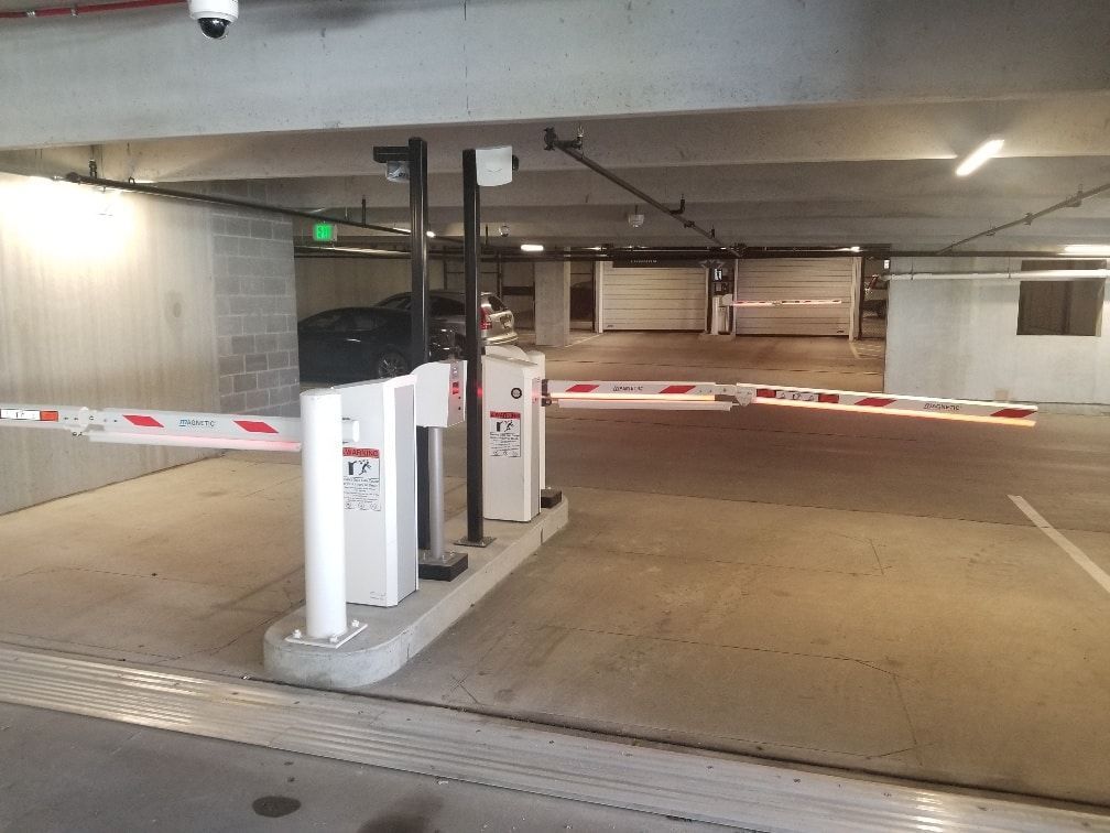 A parking garage with a gate that says ' exit ' on it