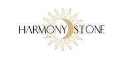 Harmony Stone logo with black text over a gold sunburst design