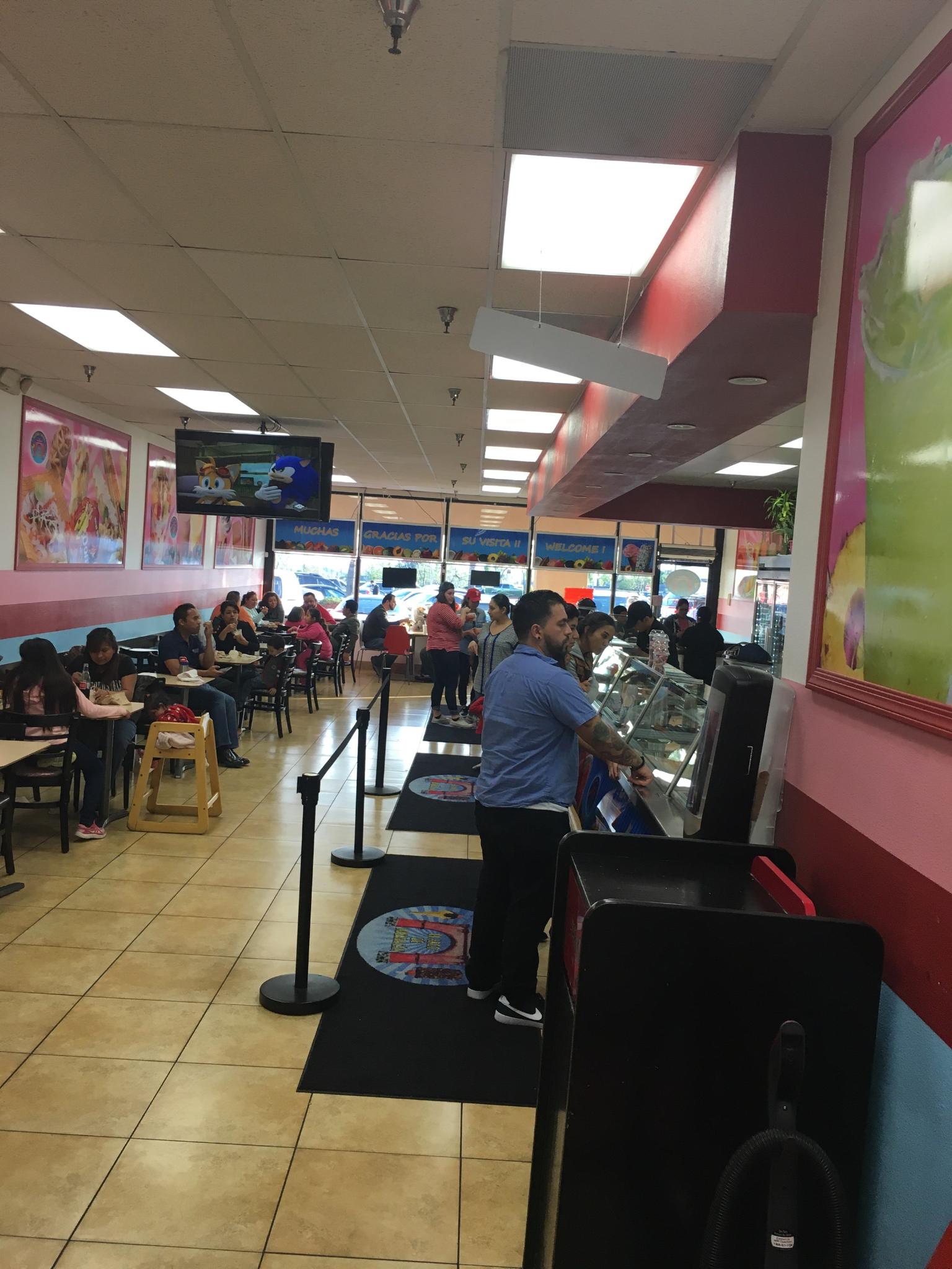 Customers eating at the Paleteria Y Neveria El Arco De Michoacan