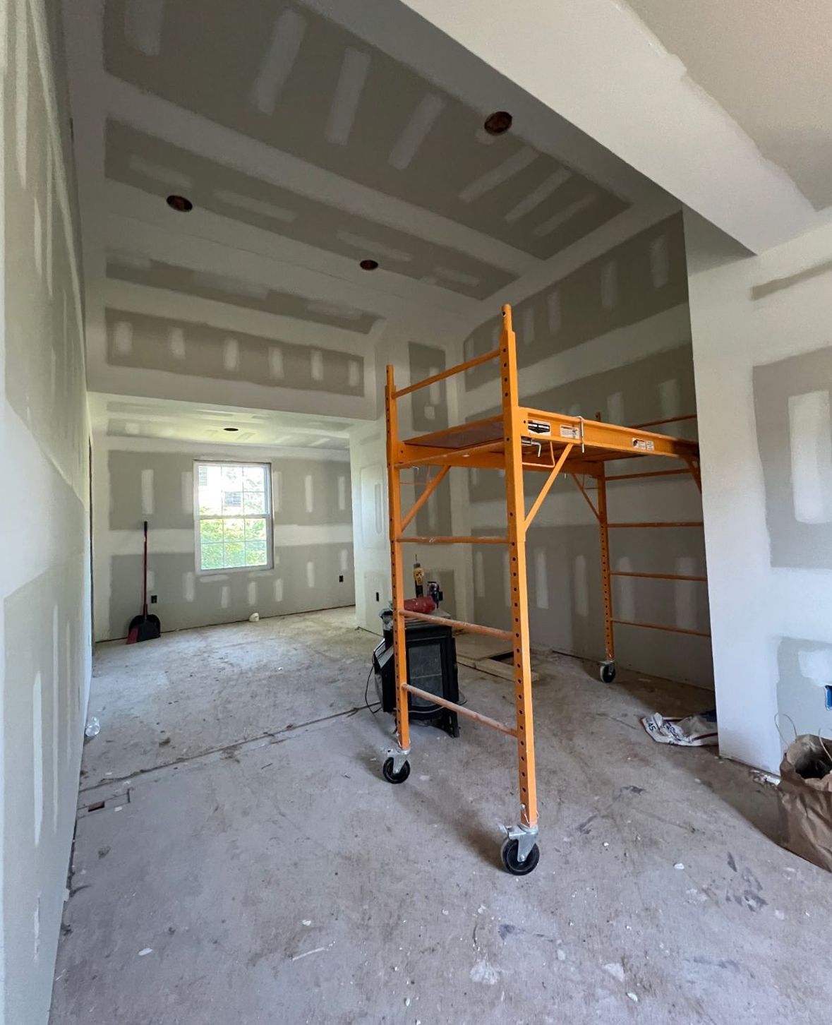 Drywall installation on interior walls of a residential home