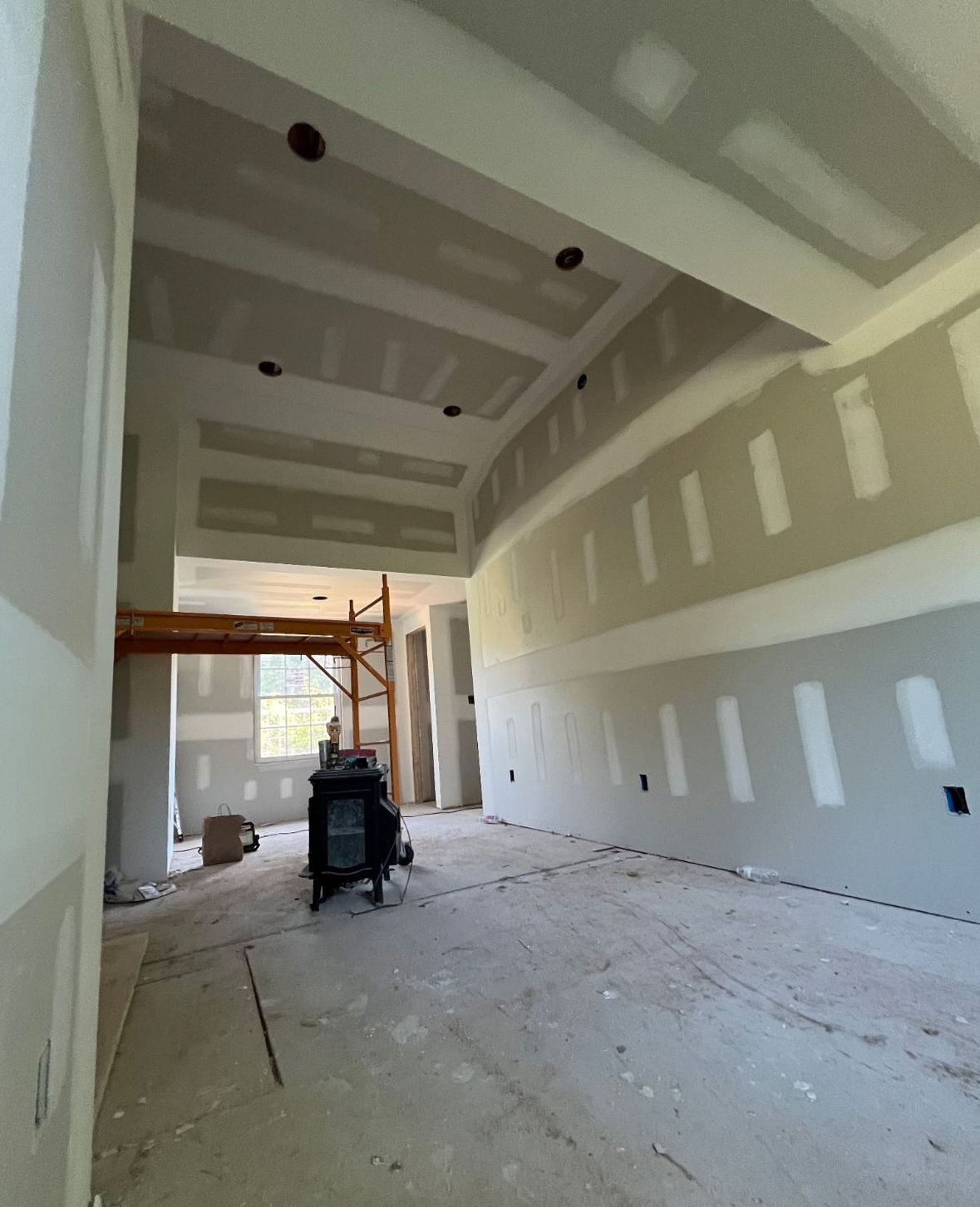 Professional drywall installation for a newly constructed interior wall