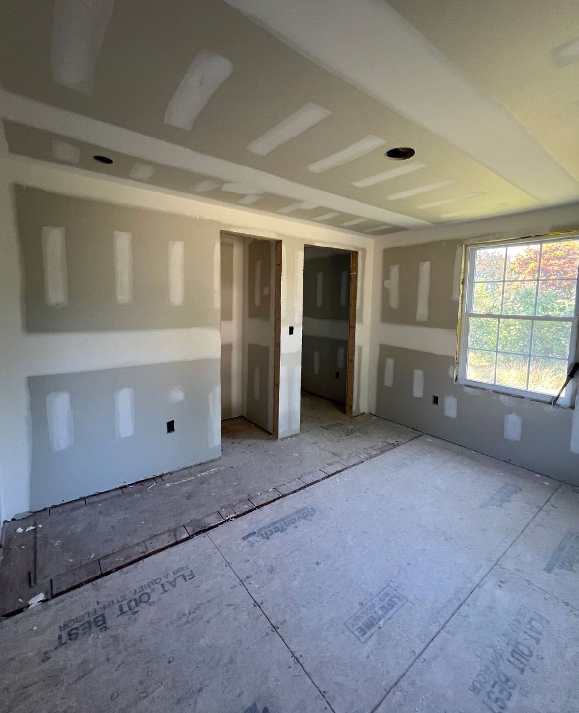 Finished drywall walls ready for taping and finishing