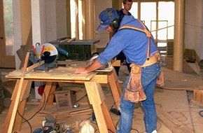 man using a table saw