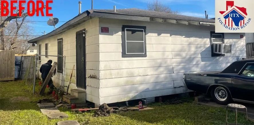Before photo of a white house exterior with a window, black car, and yard debris