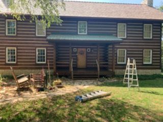 exterior painting of house in the woods