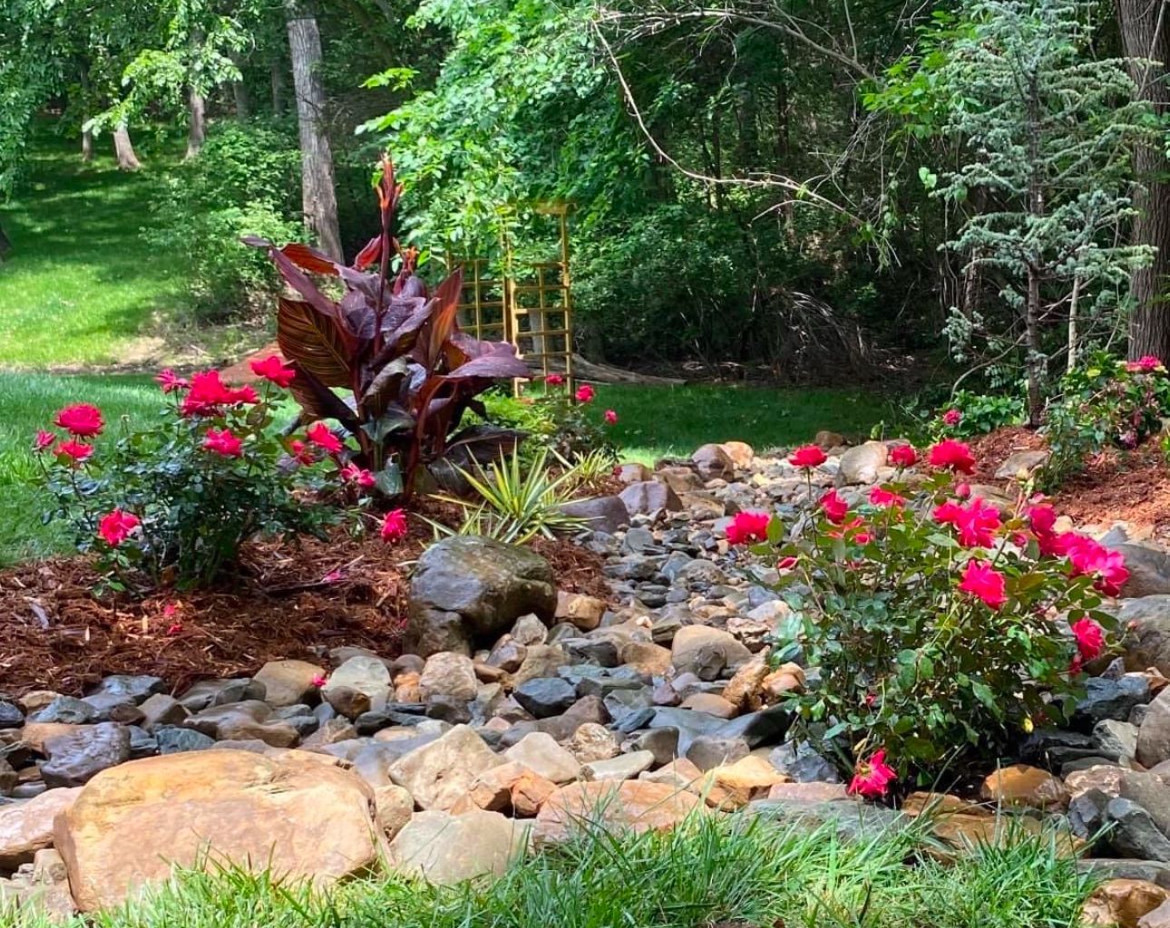 A garden filled with lots of rocks and flowers.