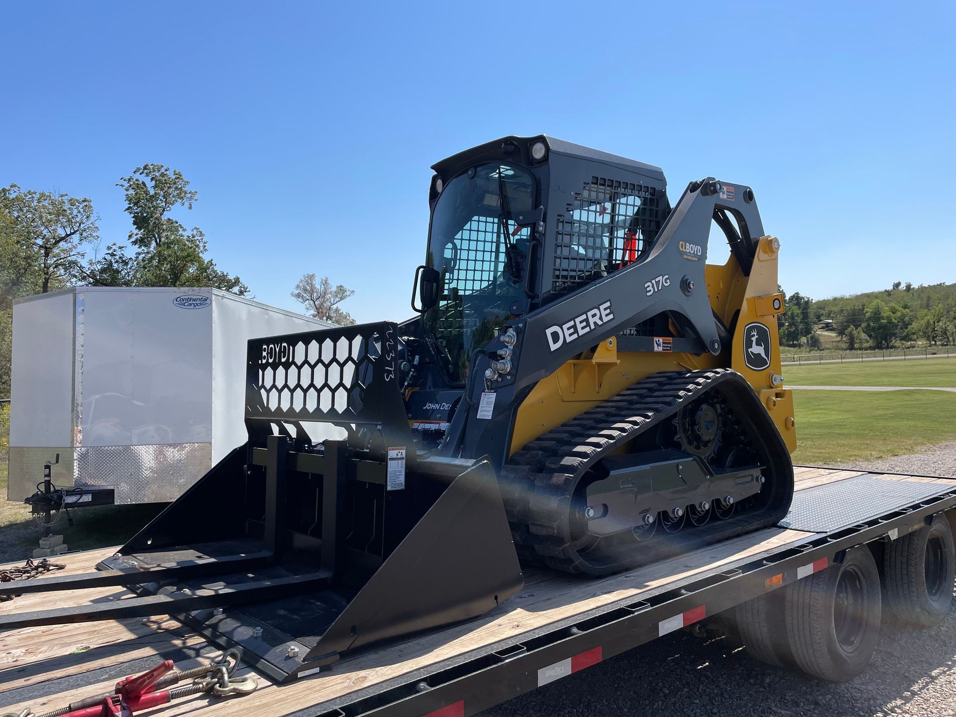 A bulldozer is sitting on top of a flatbed trailer.