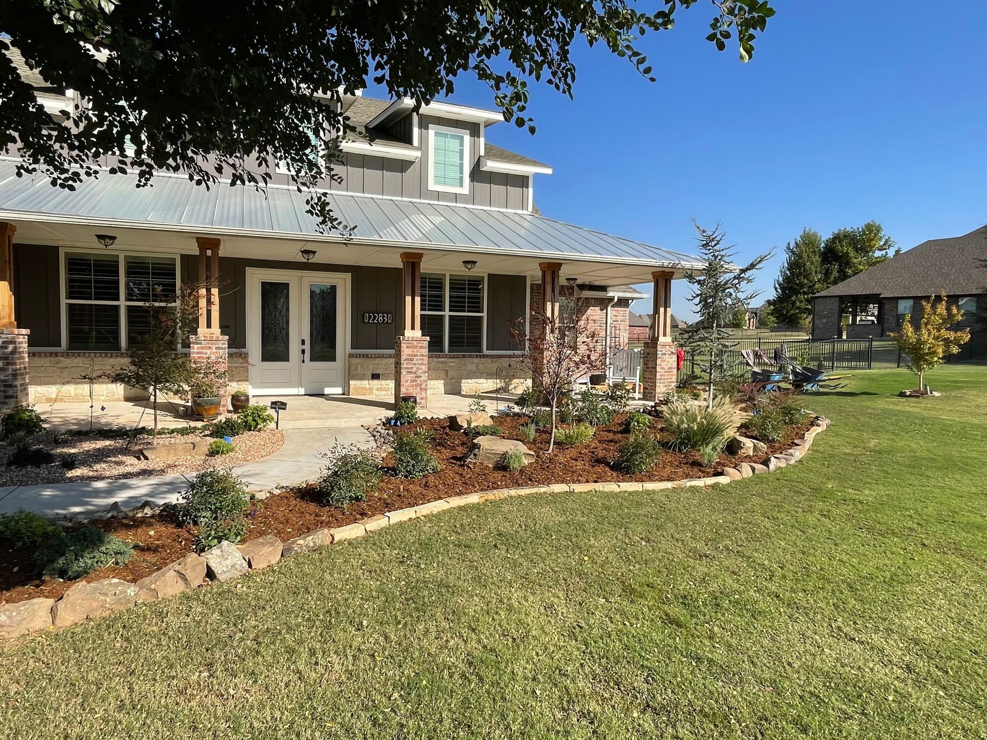 A large house with a large lawn in front of it.