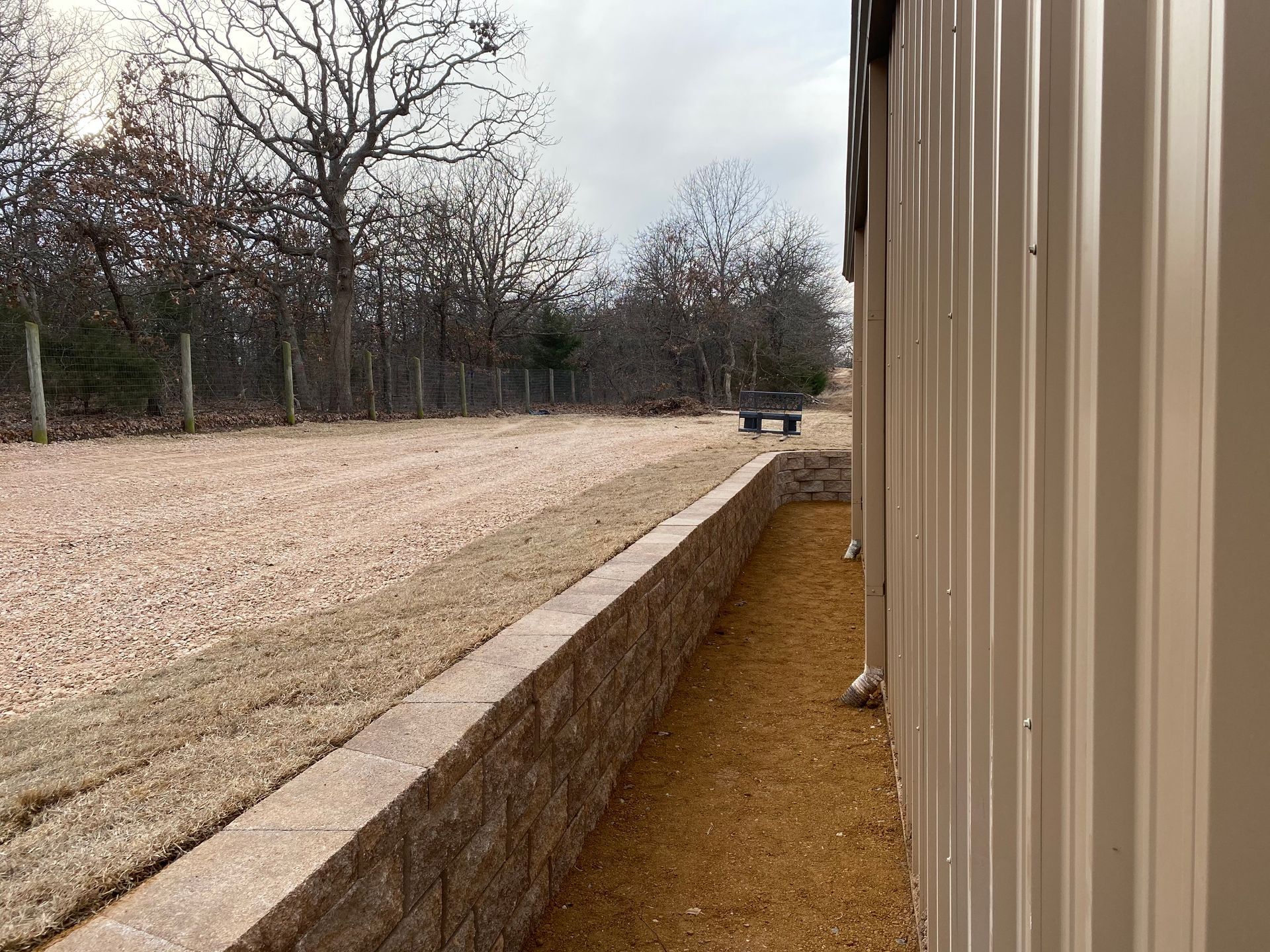 A brick wall along the side of a building.