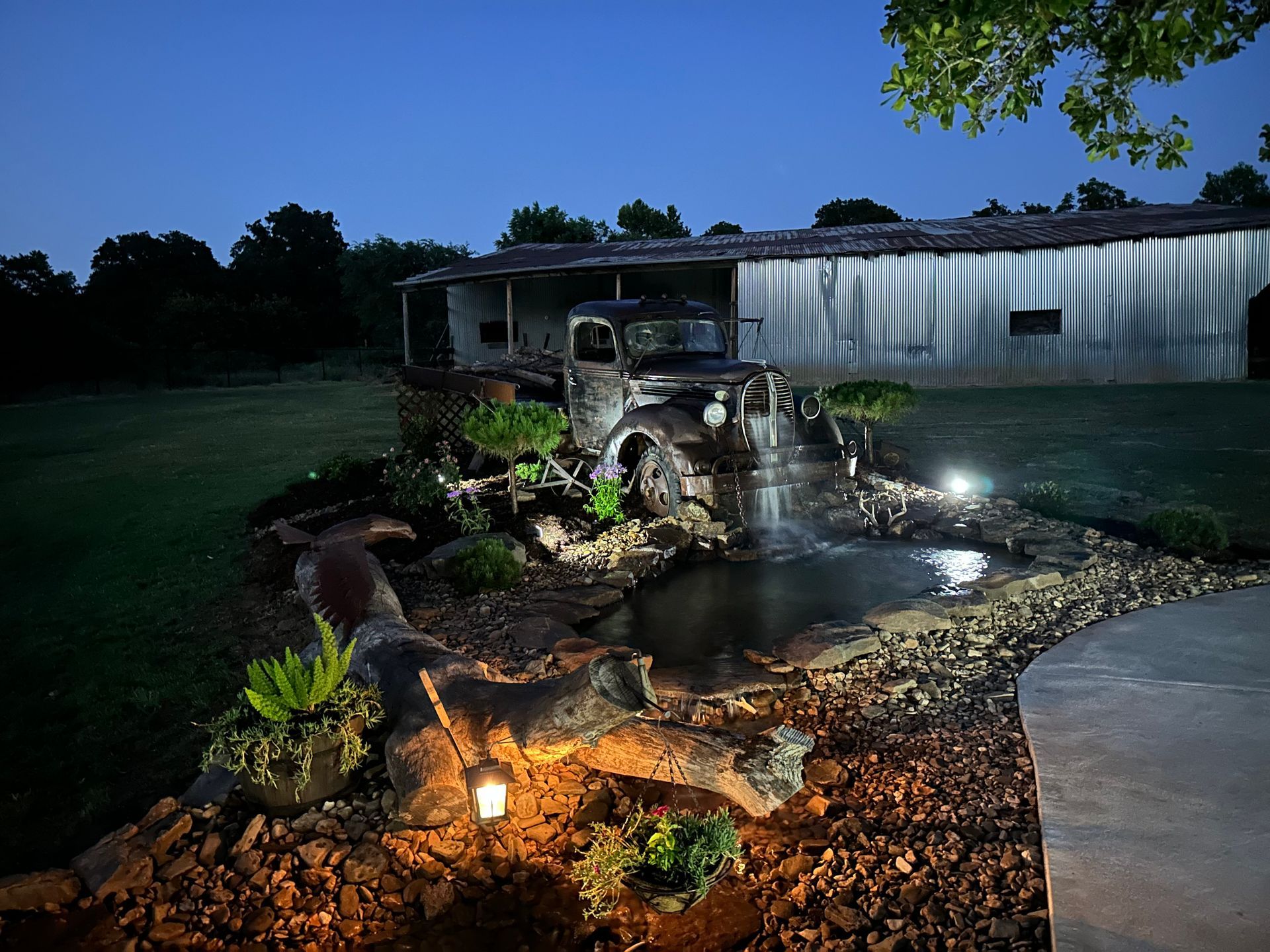 A truck is parked in front of a house at night