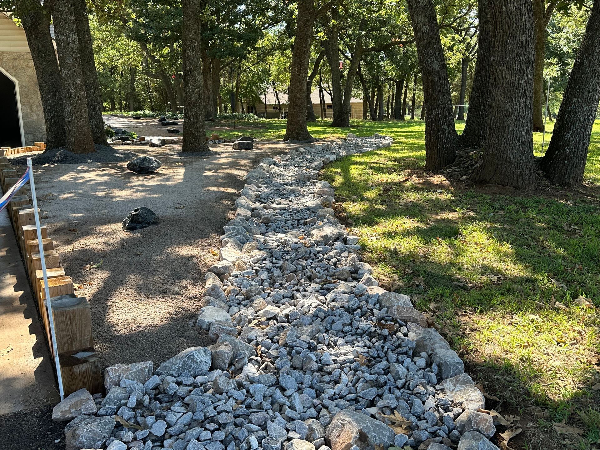A pile of rocks is sitting in the middle of a forest.