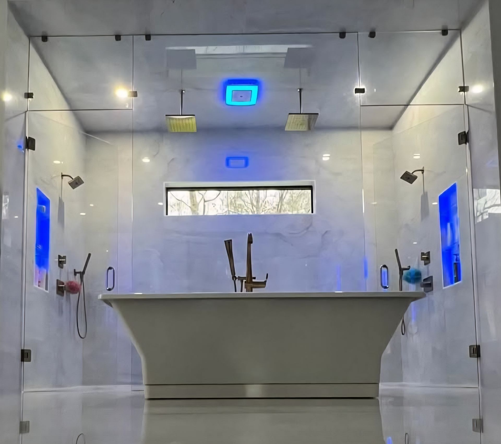Luxurious bathroom with a freestanding tub, glass shower walls, and multiple showerheads