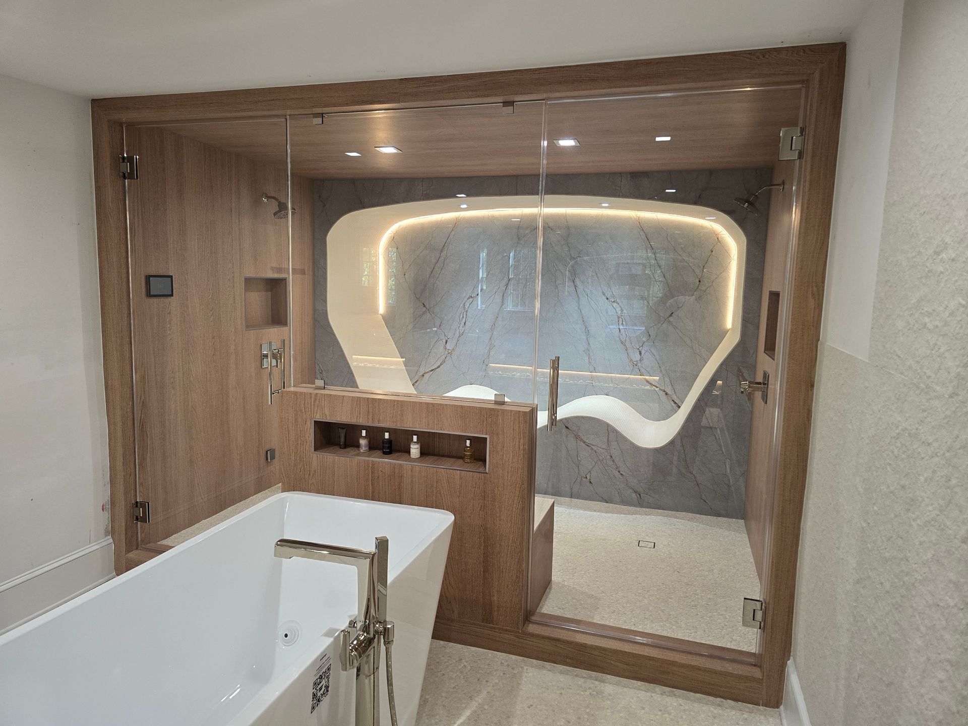 Modern bathroom with a walk-in shower, bathtub, wood paneling, and a unique, illuminated design element