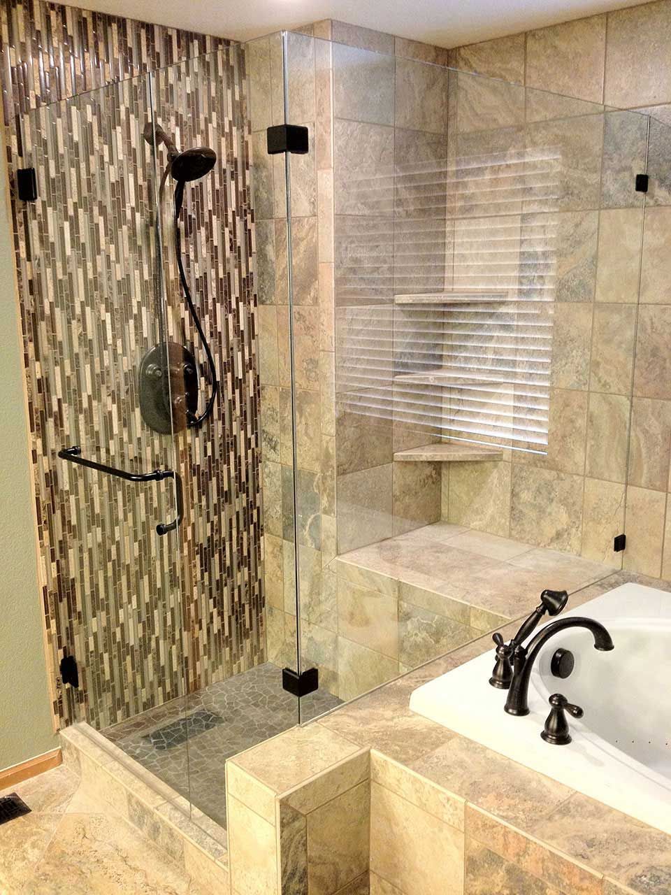 A bathroom with a tub , shower , and walk in shower.