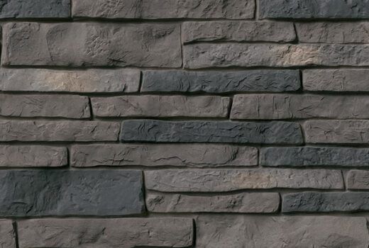 A close up of a brick wall with a lot of bricks on it.