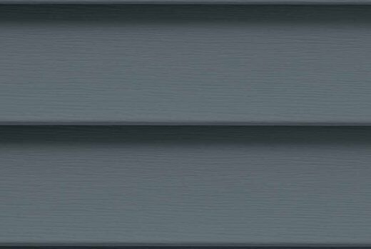 A close up of a gray siding on a house.