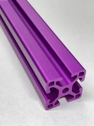 A purple aluminum extrusion is sitting on a white surface.
