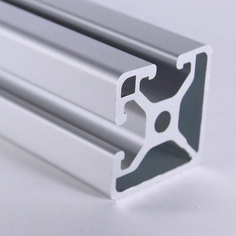 A close up of a piece of aluminum with a hole in the middle