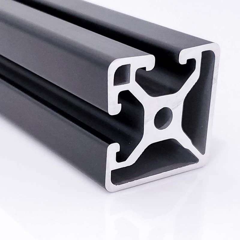 A black aluminum beam with a hole in the middle