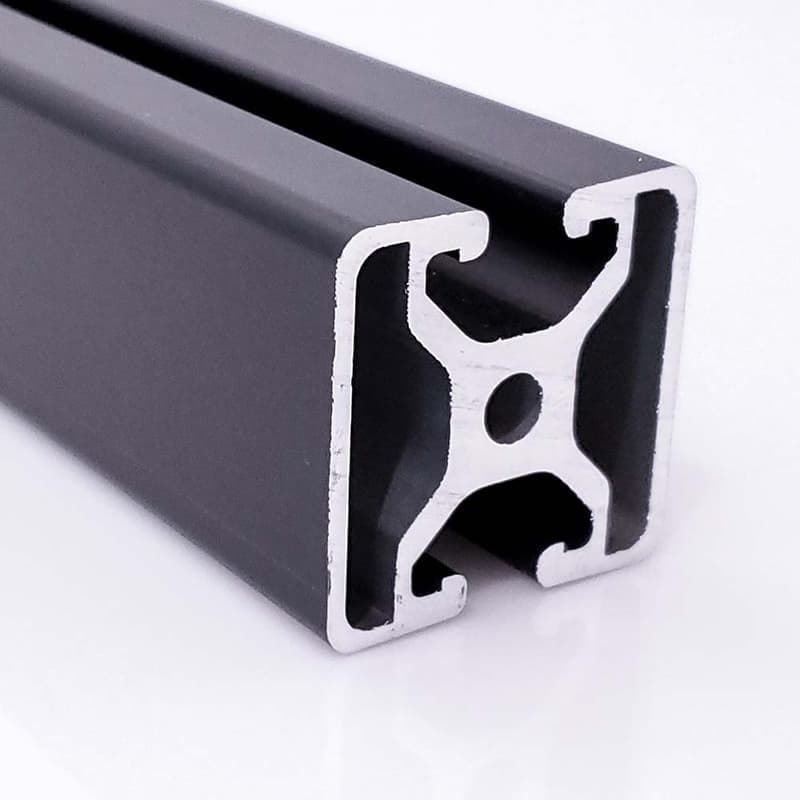 A black metal bar with a hole in the middle