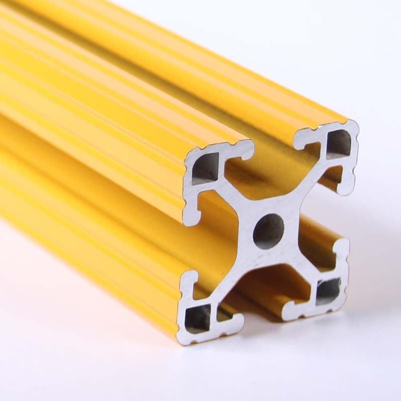 A yellow metal pipe with a hole in the middle