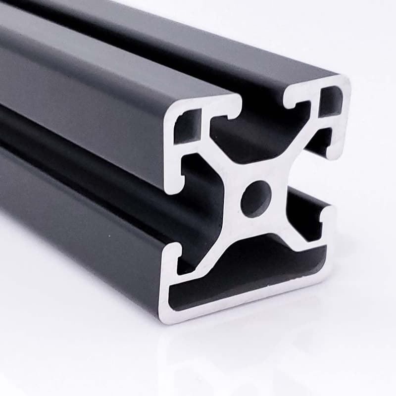 A black aluminum beam with a hole in the middle