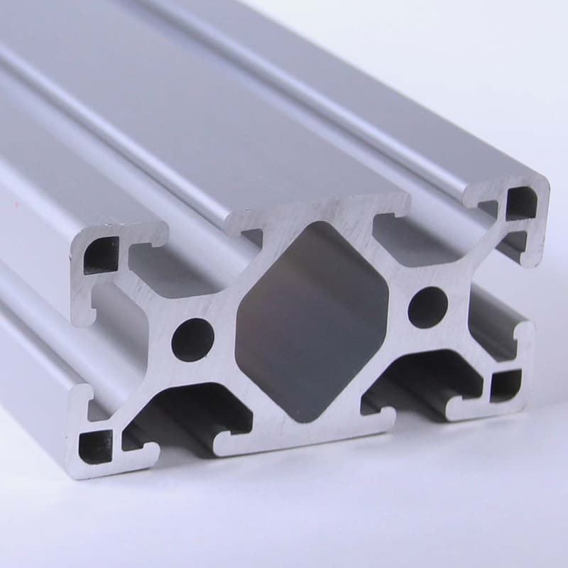 A close up of an aluminum beam on a white surface
