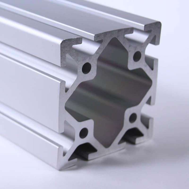 A close up of an aluminum beam on a white surface