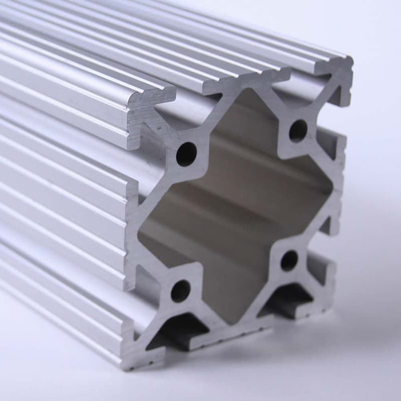 A close up of a piece of aluminum with holes in it