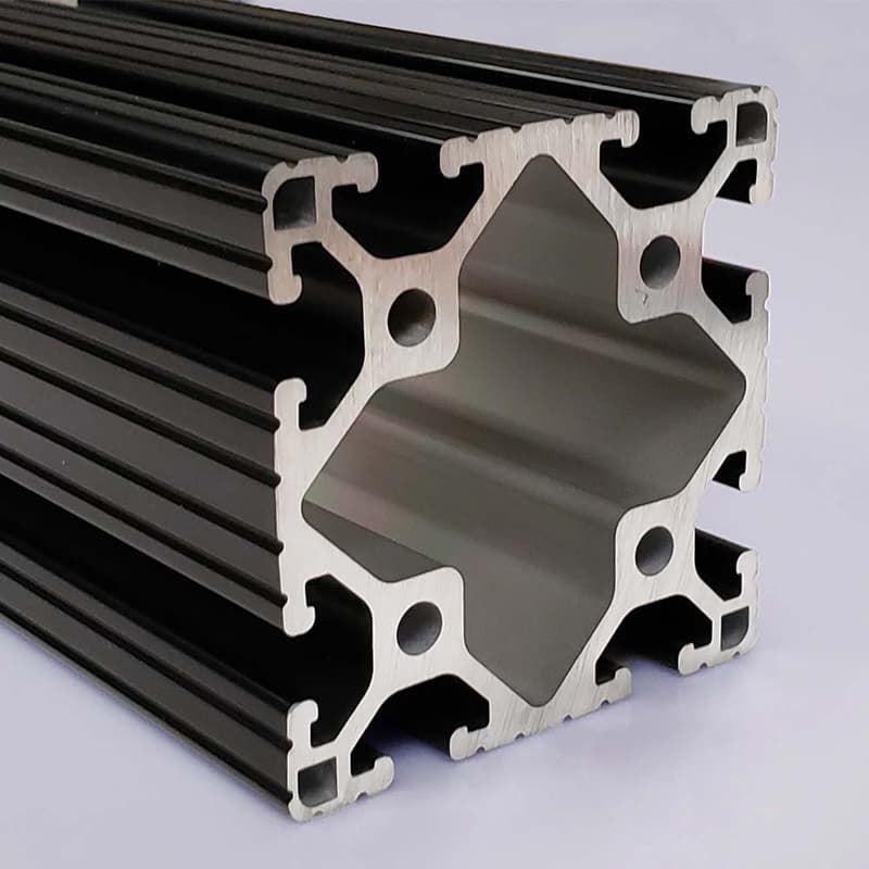 A black and silver aluminum beam with holes in it