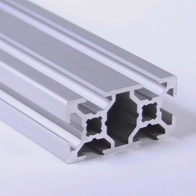 A close up of an aluminum beam on a white surface.