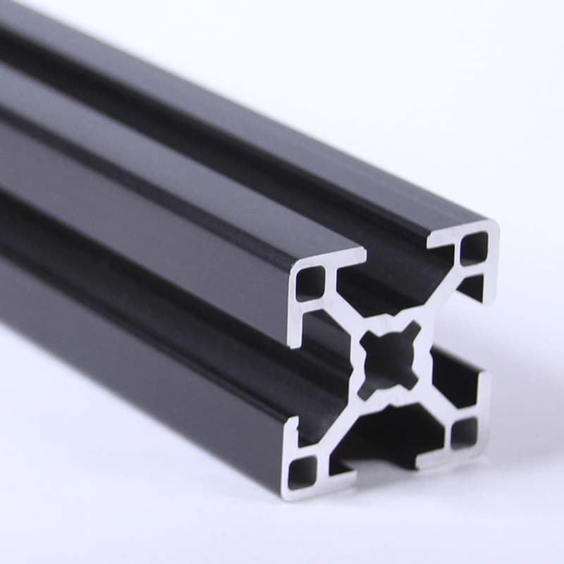 A close up of a black aluminum frame on a white surface