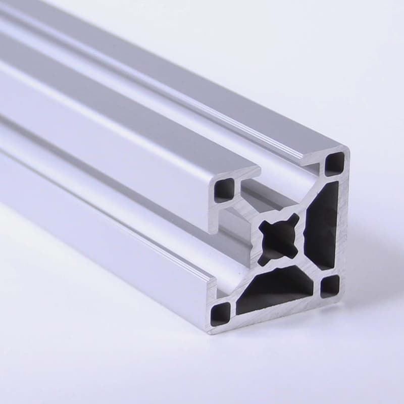 A close up of an aluminum beam on a white surface