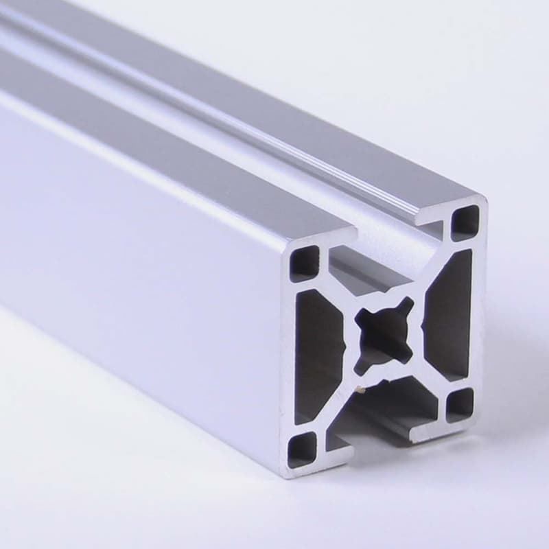 A close up of an aluminum beam on a white surface