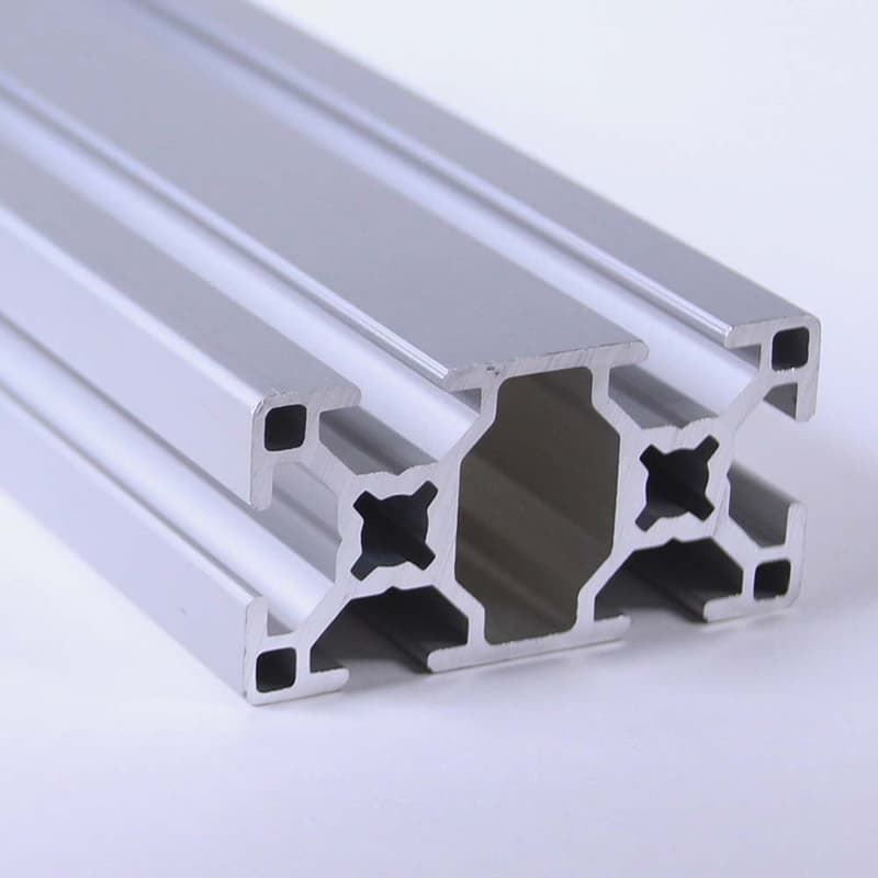 A close up of an aluminum beam on a white surface