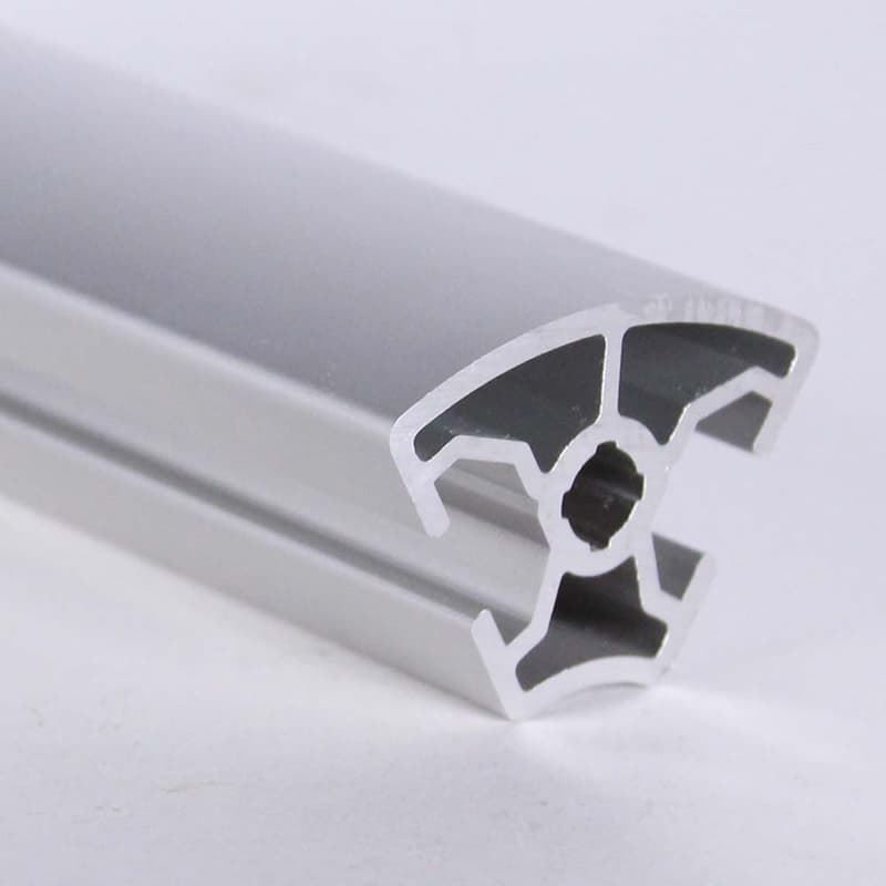 A close up of a piece of aluminum on a white surface.